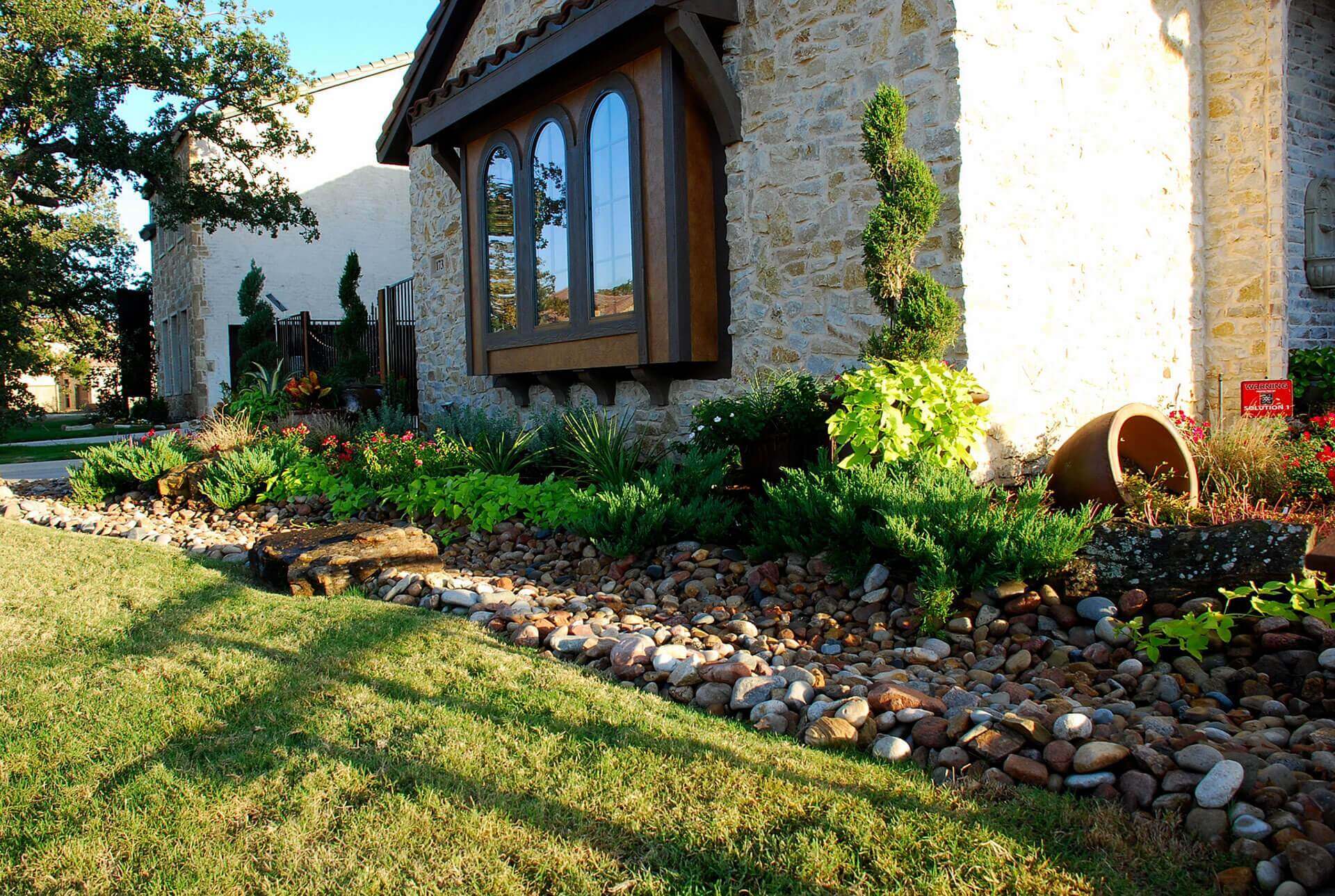 garden landscaped with rocks and plants